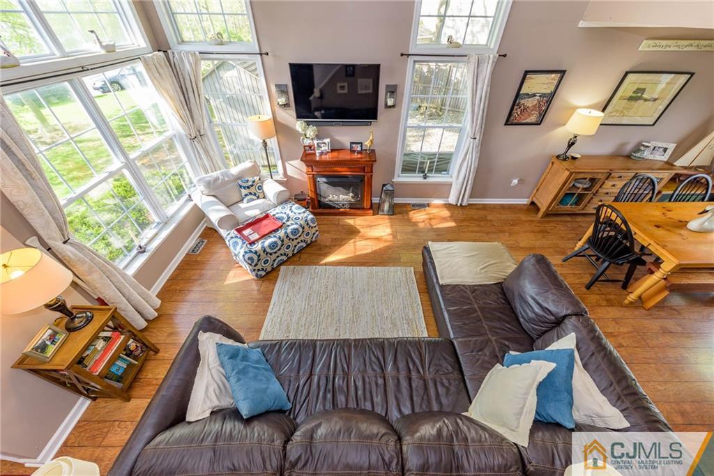 105 Quadrant Road Manahawkin, NJ 08050 - Photo 4 of 25 a living room with furniture and a flat screen tv