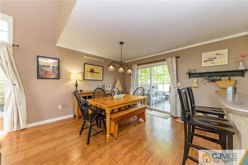 105 Quadrant Road Manahawkin, NJ 08050 - Photo 6 of 25 a view of a dining room with furniture window and wooden floor