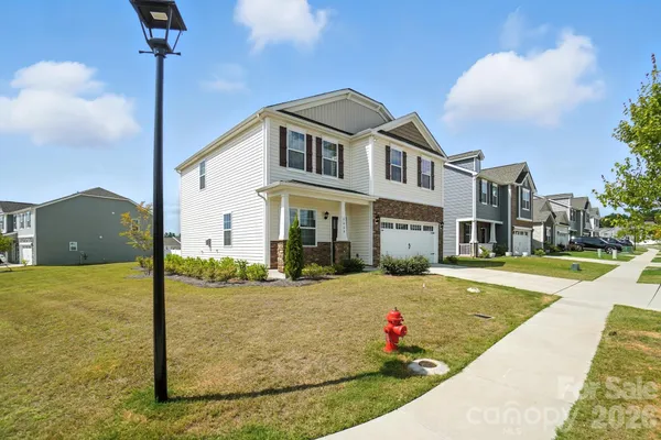 a front view of a house with yard