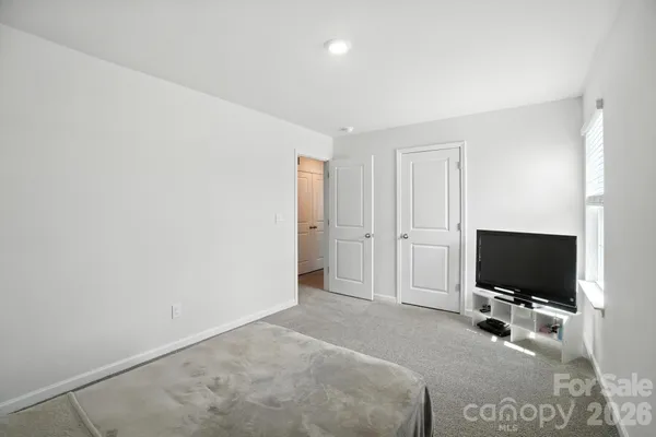 a view of a livingroom with a flat screen tv and outdoor space