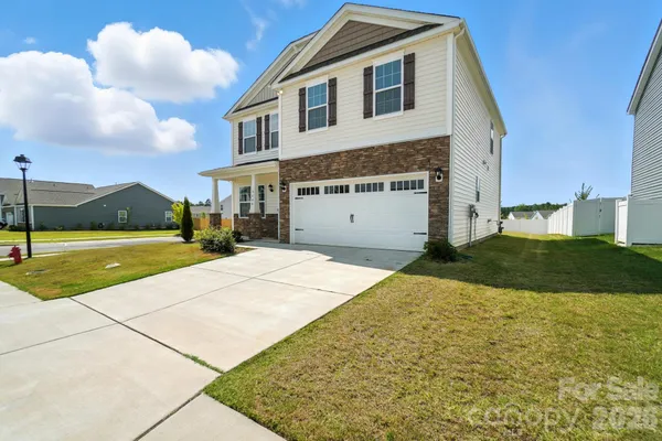 a front view of a house with yard