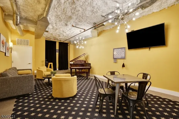 a dining room with a table and chairs