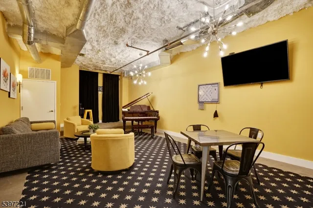 a dining room with a table and chairs