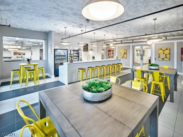 a living room filled with furniture and a chandelier