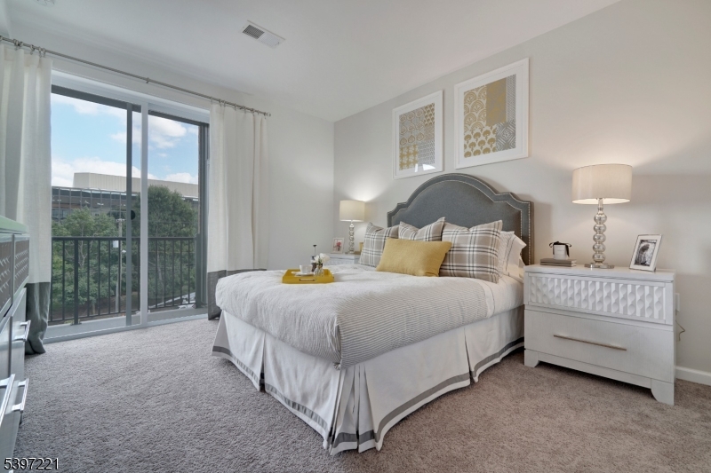 3 Ronson Road Woodbridge, NJ 08830 - Photo 3 of 17 a spacious bedroom with a bed and a night stand