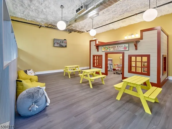 a living room filled with furniture and wooden floor
