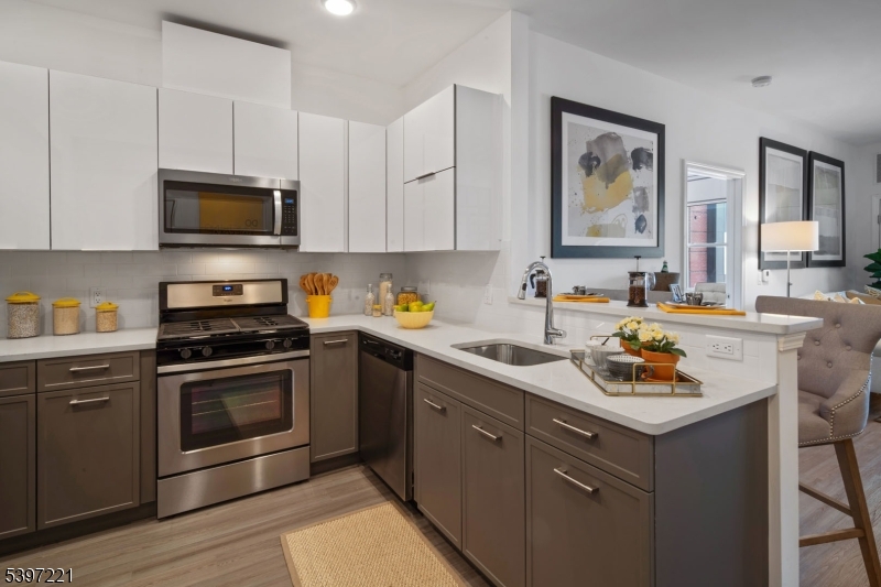 3 Ronson Road Woodbridge, NJ 08830 - Photo 8 of 17 a kitchen with a stove and a sink