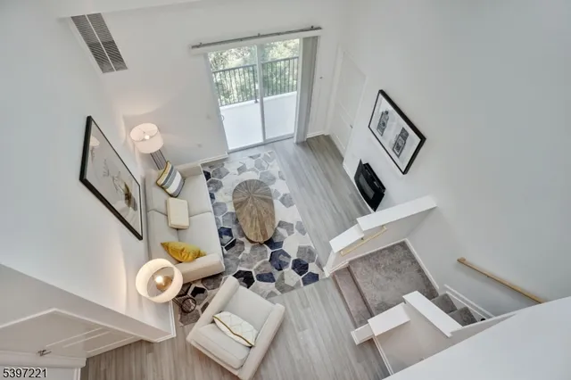 a view of living room with furniture and a window
