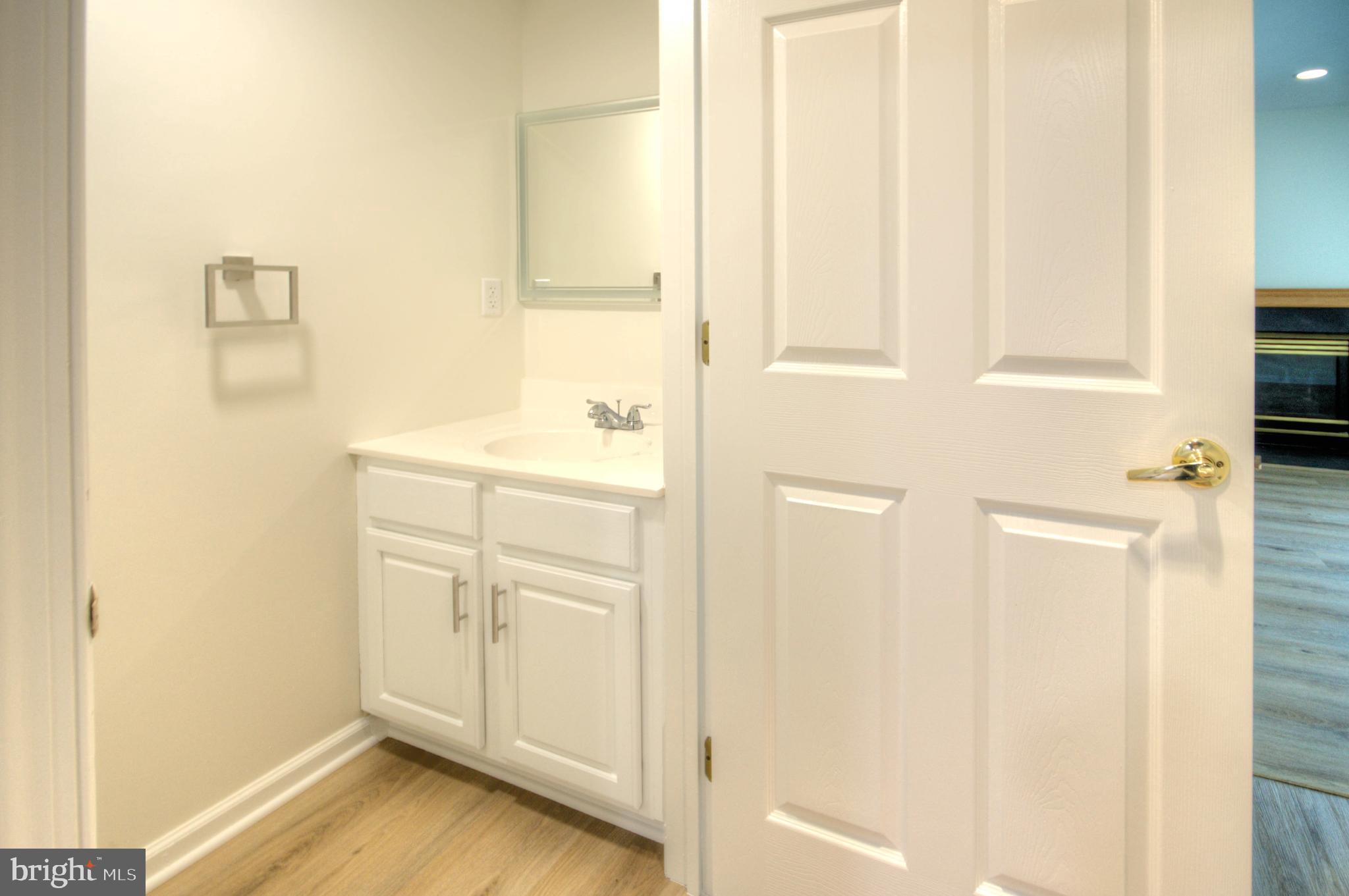 18 Alexandra Court Marlton, NJ 08053 - Photo 14 of 41 a bathroom with a sink and a mirror