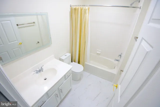 a bathroom with a sink a toilet and a bathtub