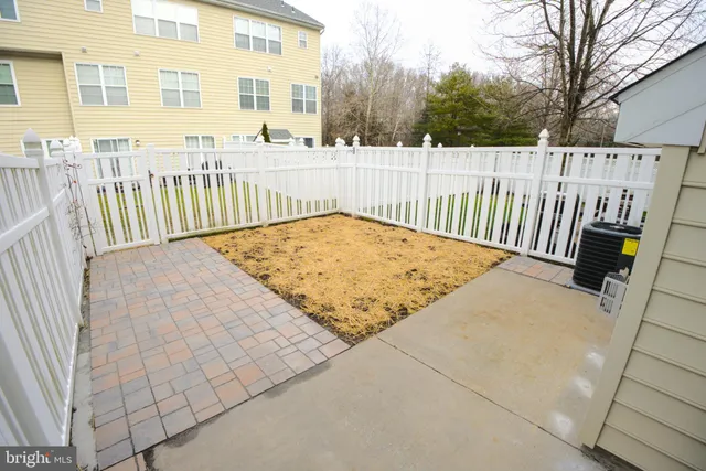 a view of a balcony with wooden fence