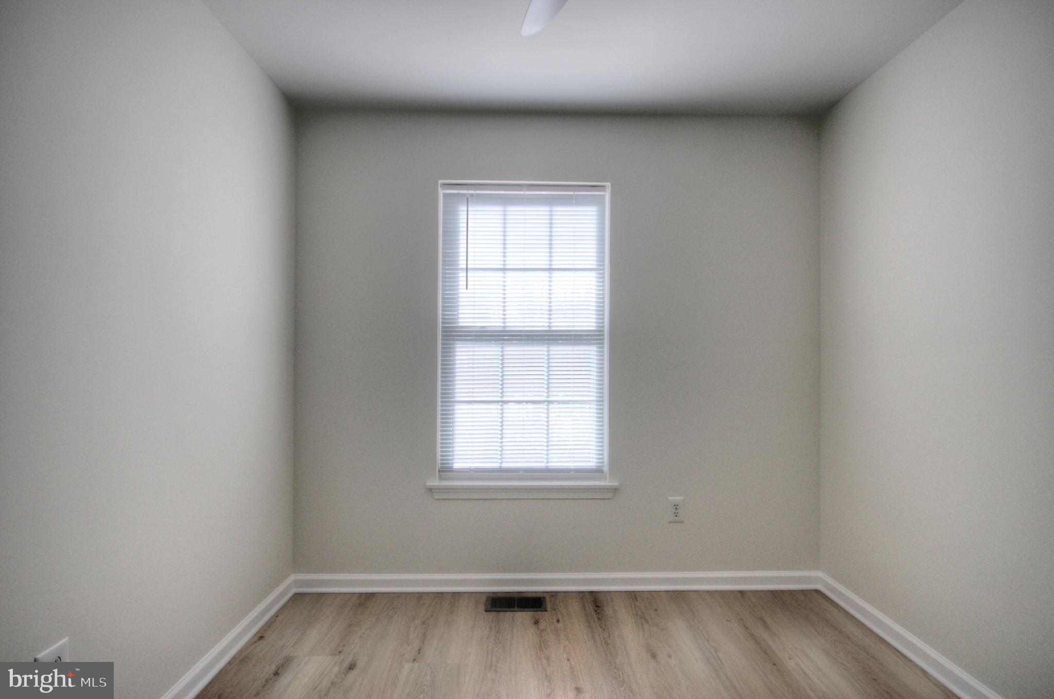 18 Alexandra Court Marlton, NJ 08053 - Photo 32 of 41 an empty room with wooden floor and windows
