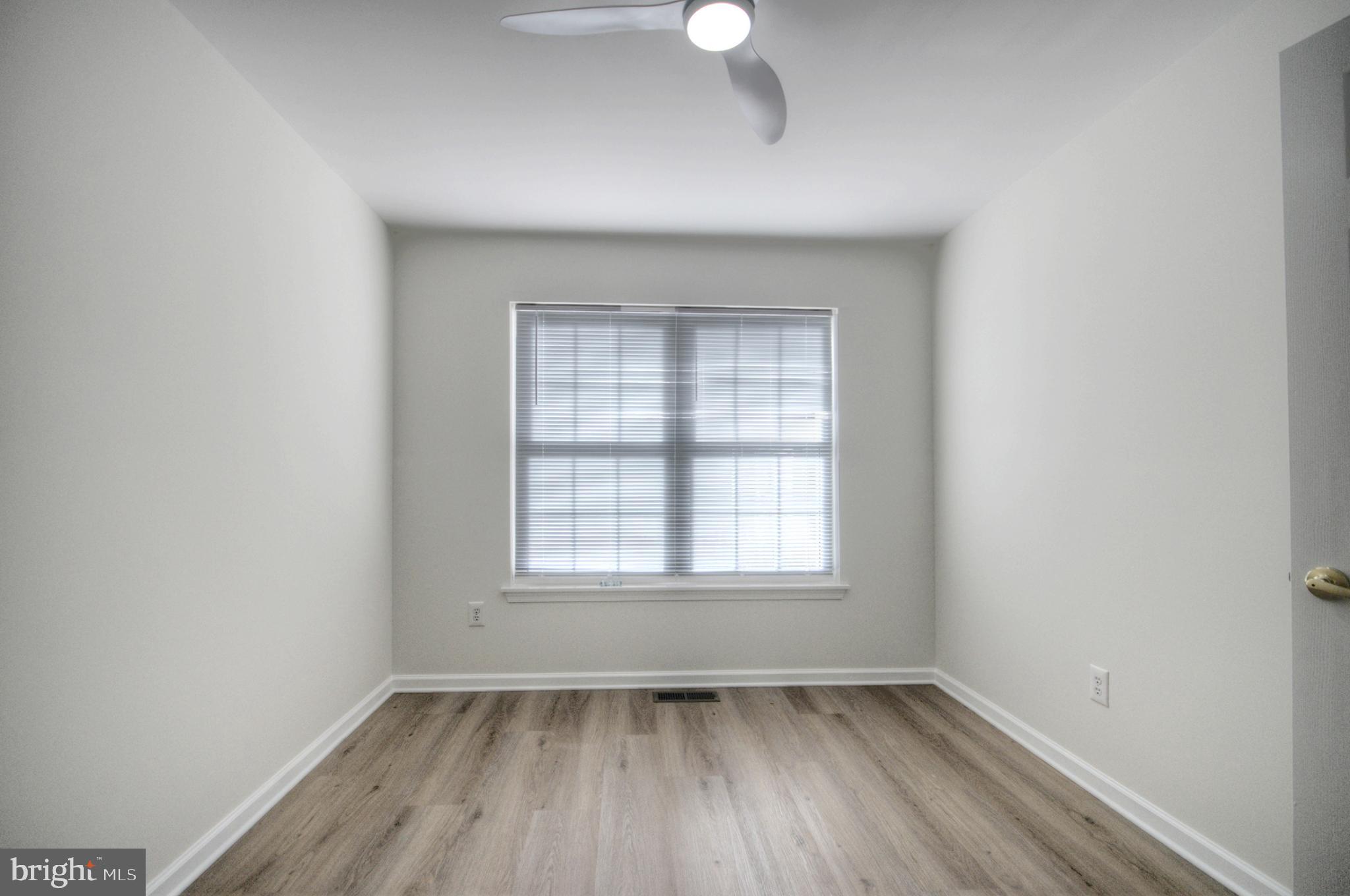 18 Alexandra Court Marlton, NJ 08053 - Photo 33 of 41 an empty room with wooden floor and windows