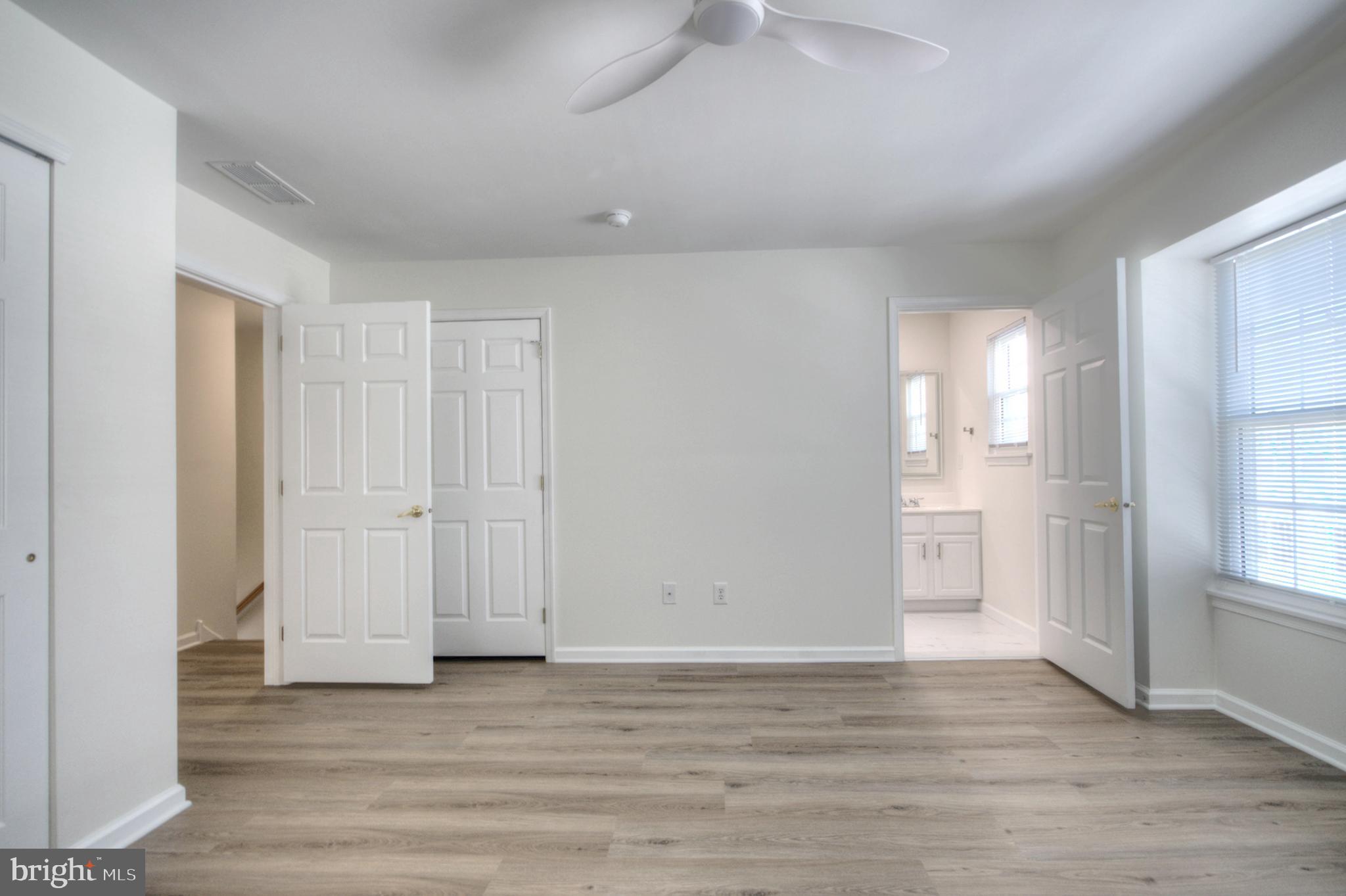 18 Alexandra Court Marlton, NJ 08053 - Photo 39 of 41 a view of empty room with wooden floor and window