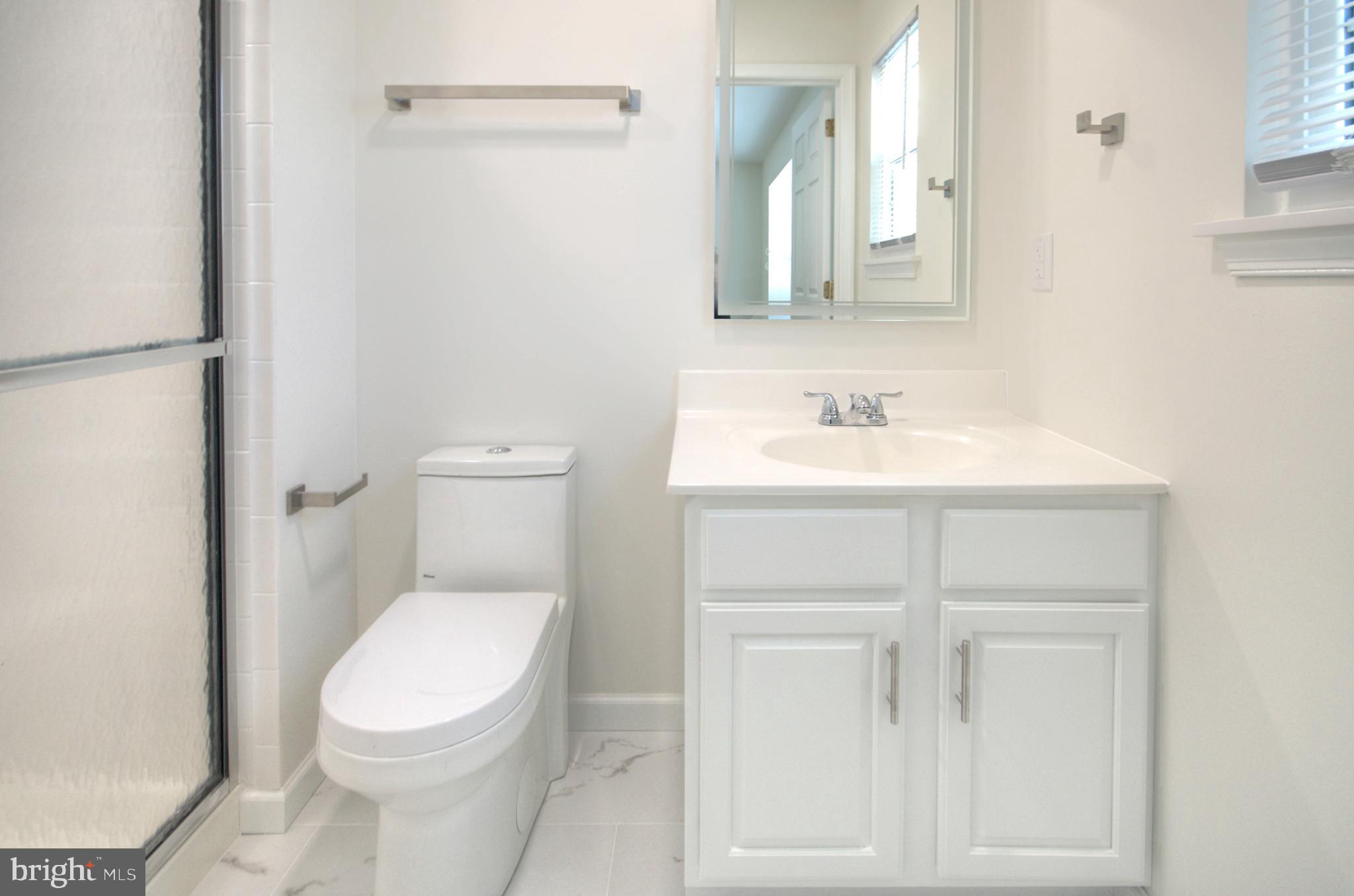 18 Alexandra Court Marlton, NJ 08053 - Photo 40 of 41 a white toilet sitting next to a bathroom sink