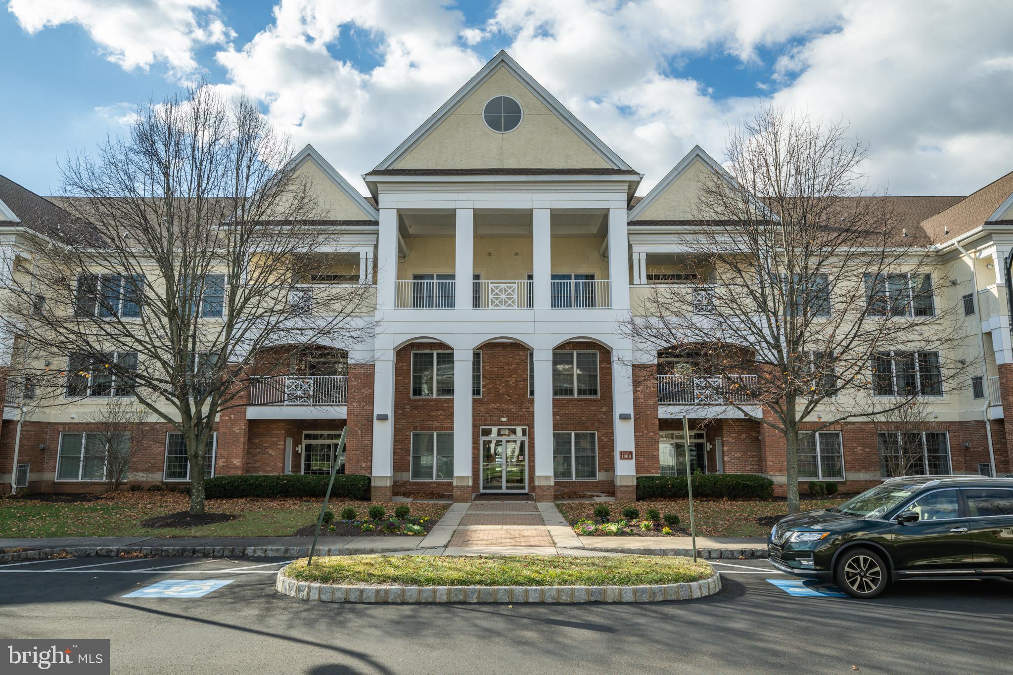 1333 Meridian Boulevard, Unit 1333 Warrington, PA 18976 - Photo 1 of 25 a front view of a building with garden