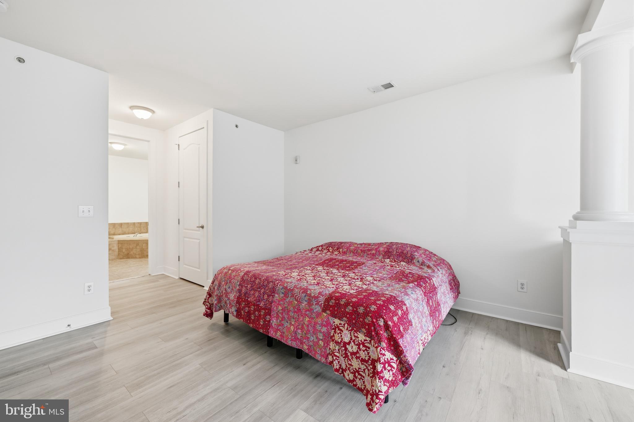 1333 Meridian Boulevard, Unit 1333 Warrington, PA 18976 - Photo 15 of 25 a bedroom with a bed and a table