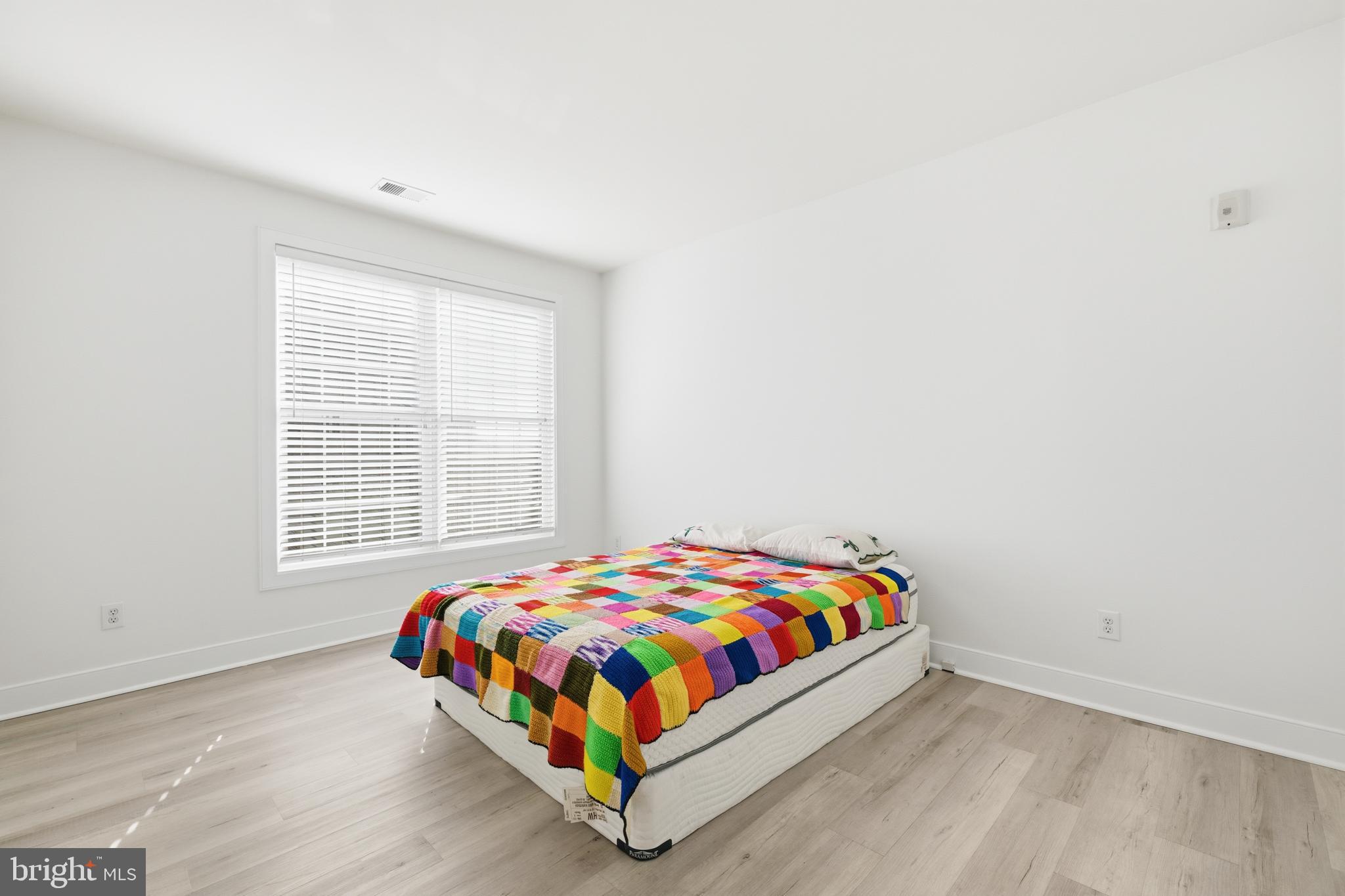 1333 Meridian Boulevard, Unit 1333 Warrington, PA 18976 - Photo 20 of 25 a room with a bed and a window