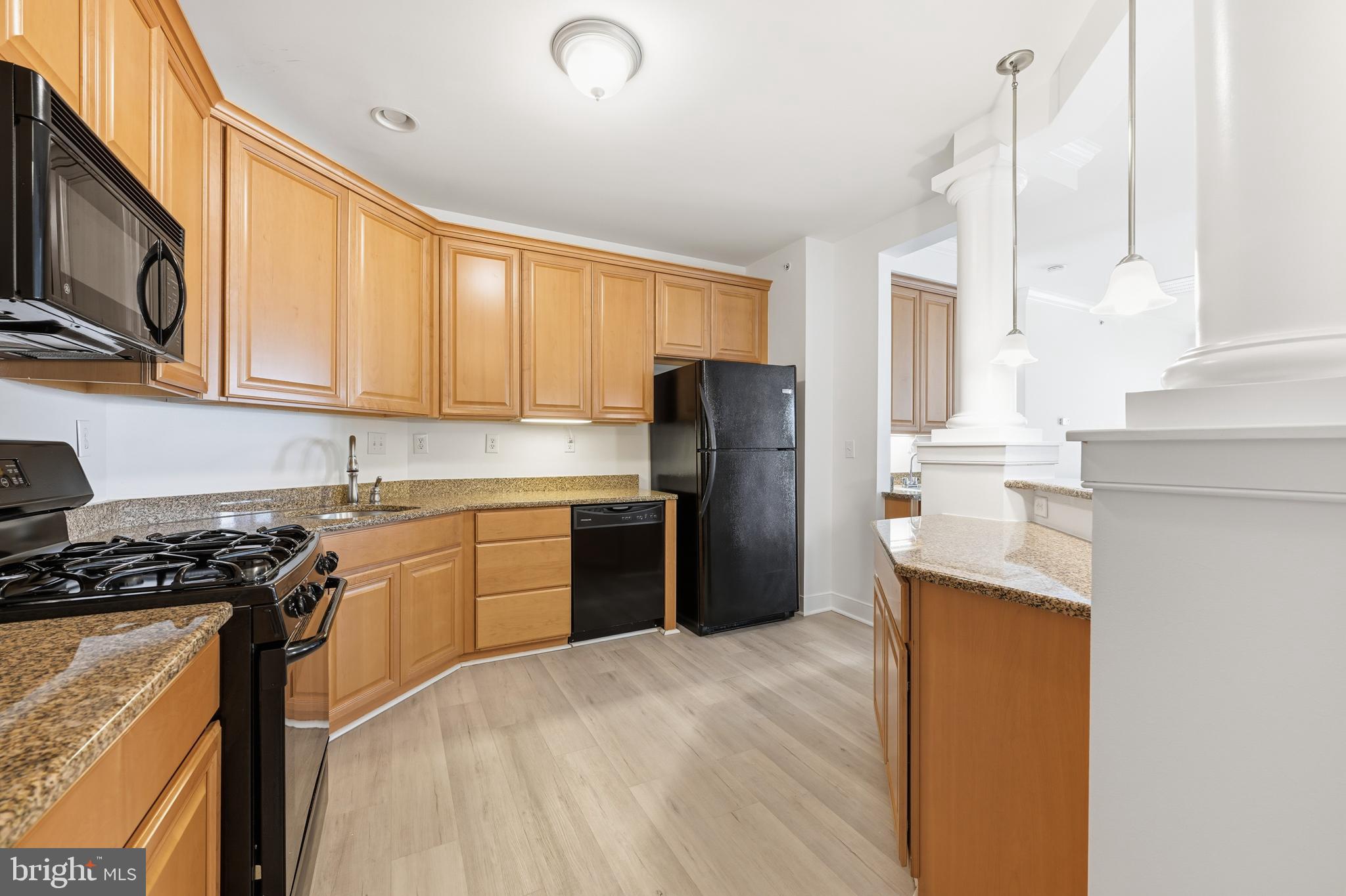 1333 Meridian Boulevard, Unit 1333 Warrington, PA 18976 - Photo 4 of 25 a kitchen with stainless steel appliances granite countertop a refrigerator a stove top oven a sink and dishwasher