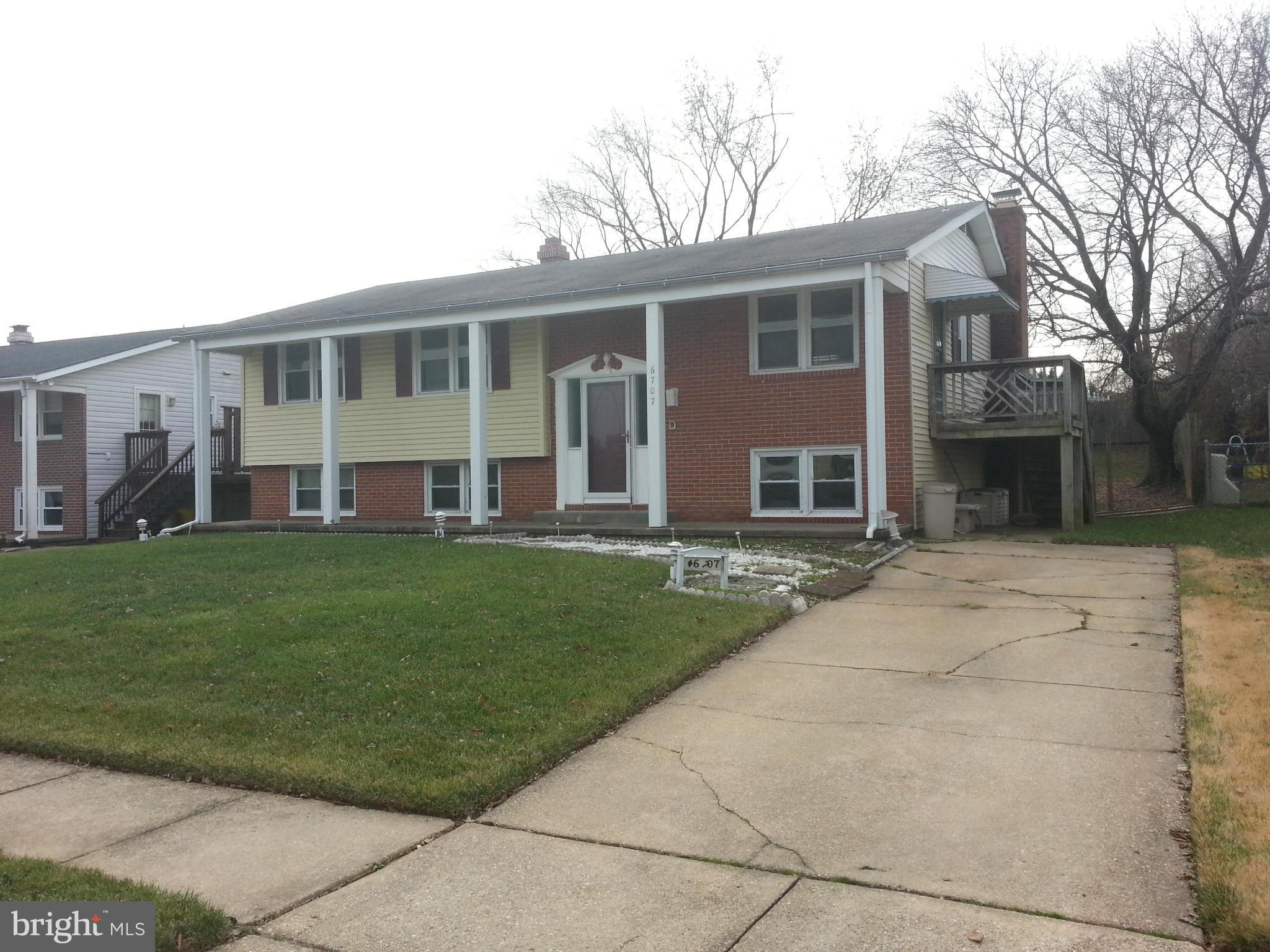 6707 Fordcrest Road Baltimore, MD 21237 - Photo 1 of 21 front view of a house with a yard