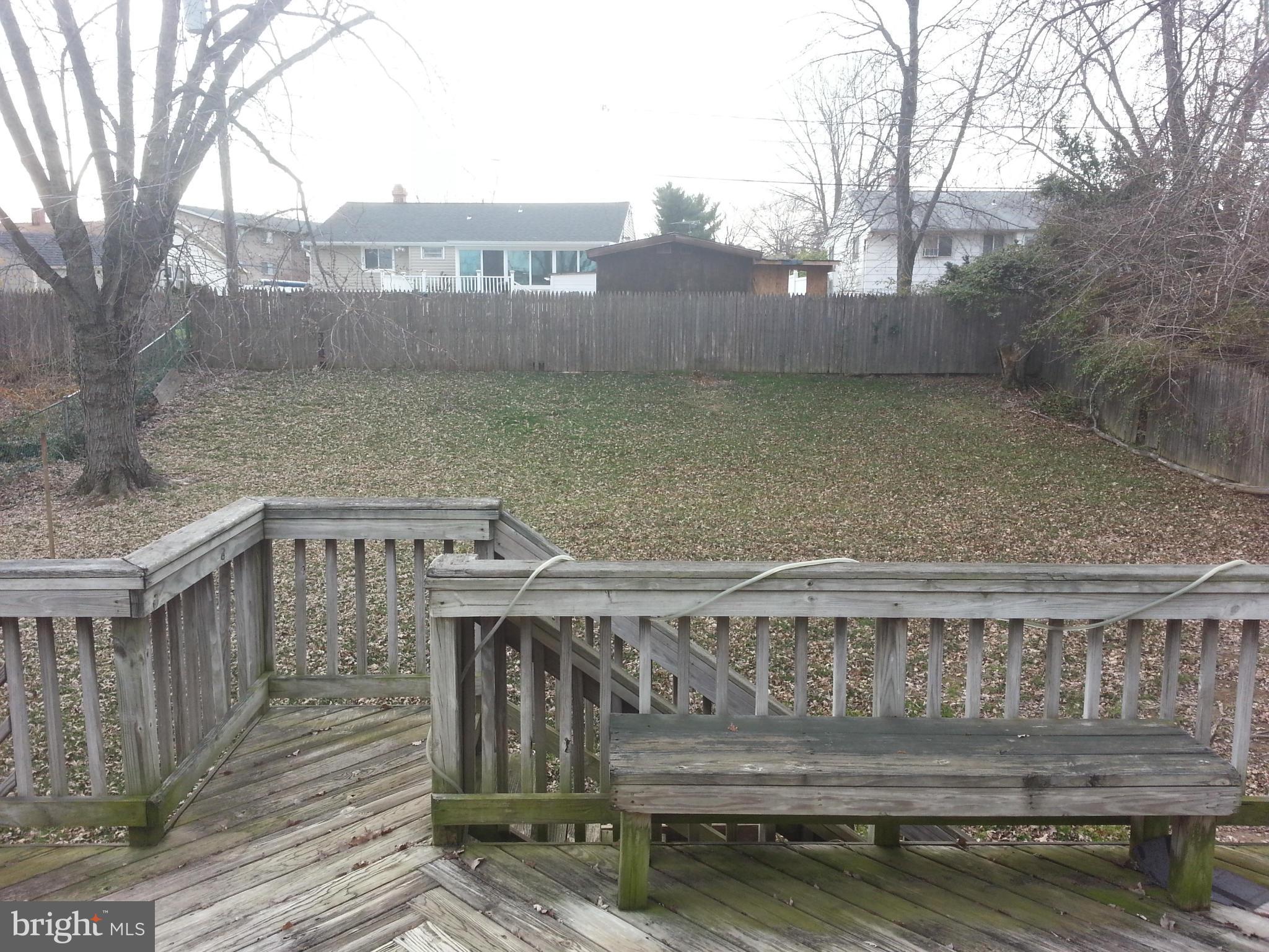 6707 Fordcrest Road Baltimore, MD 21237 - Photo 5 of 21 a view of a roof deck with wooden fence and floor