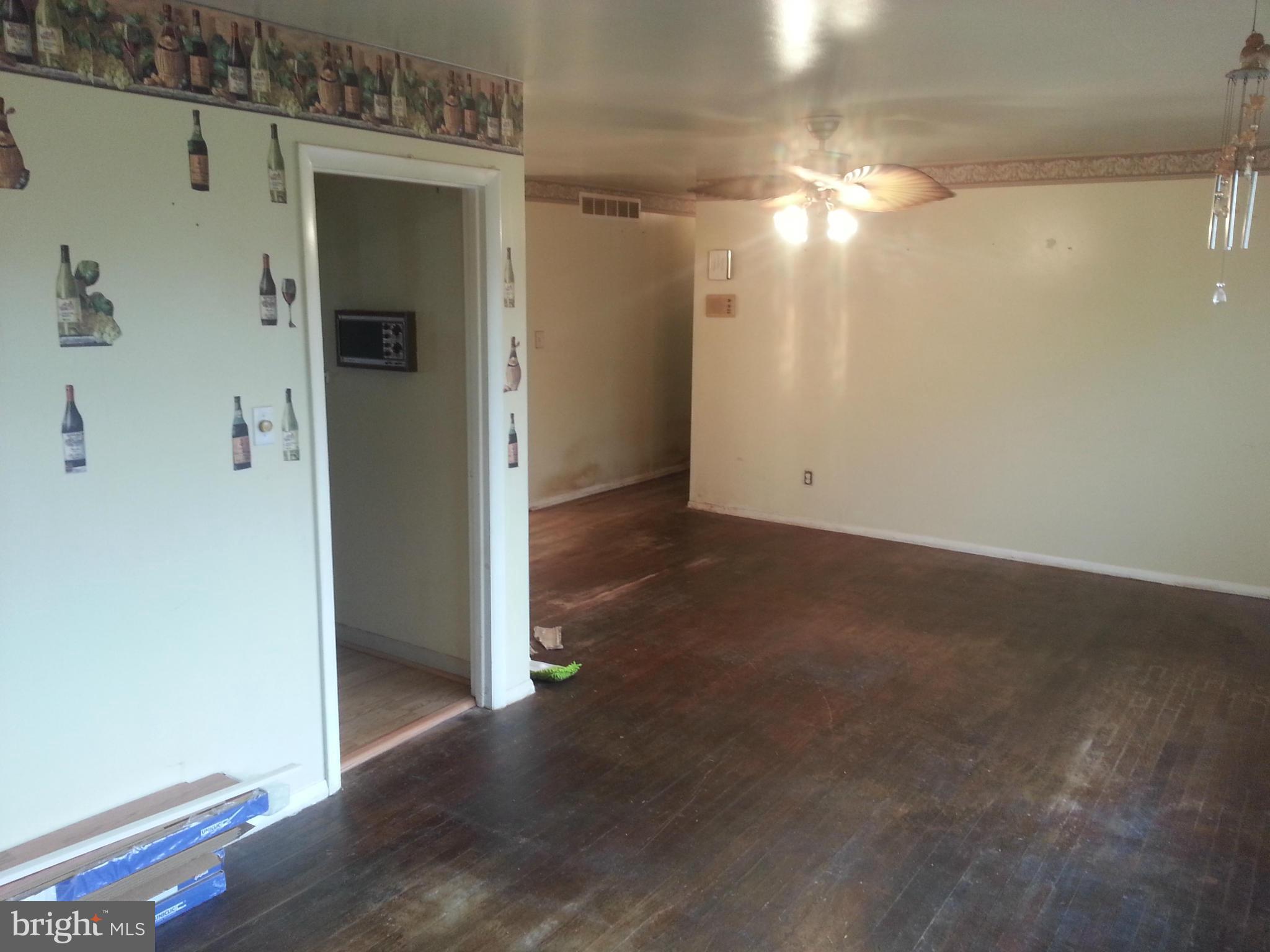 6707 Fordcrest Road Baltimore, MD 21237 - Photo 8 of 21 an empty room with wooden floor