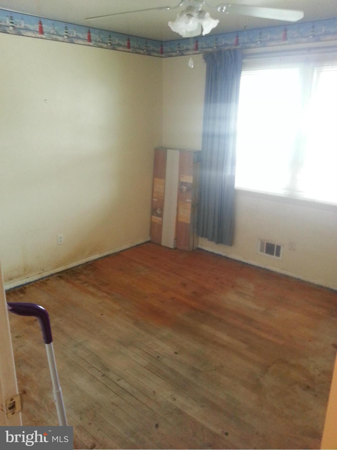 6707 Fordcrest Road Baltimore, MD 21237 - Photo 10 of 21 a view of a room with wooden floor and windows