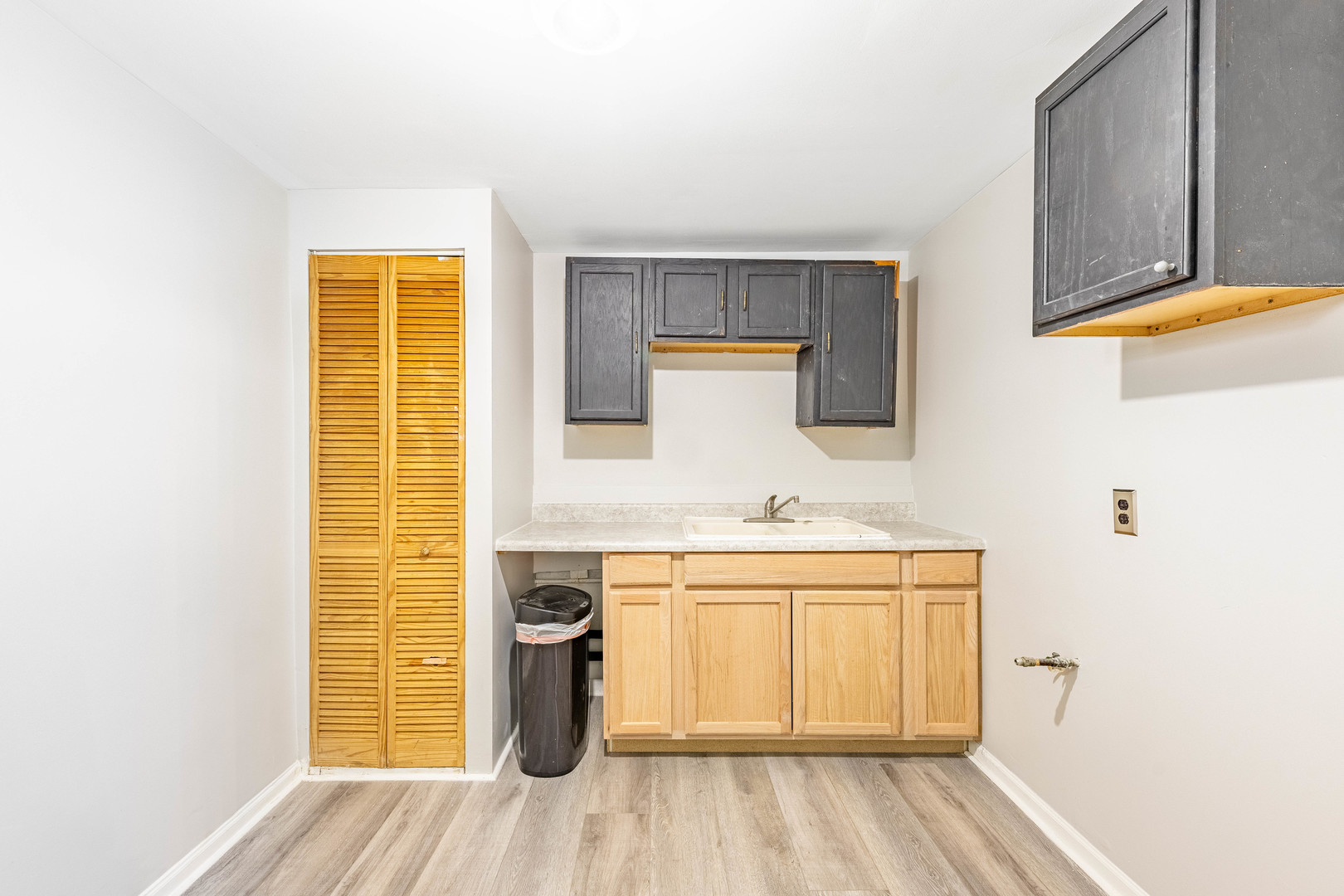 3022 South Homan Avenue Chicago, IL 60623 - Photo 13 of 29 a kitchen with a sink and wooden floor