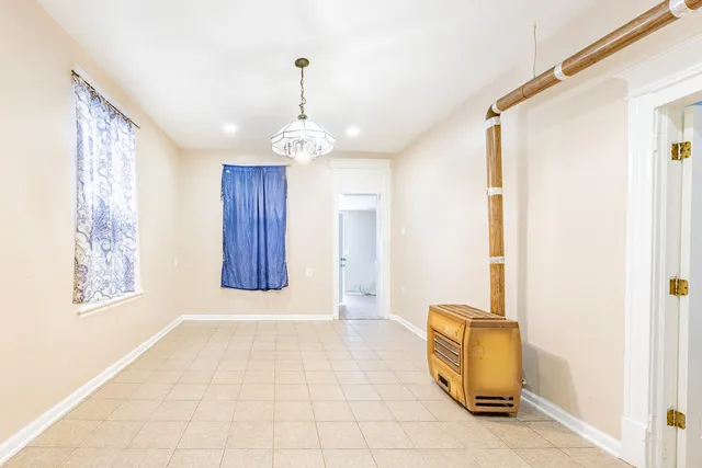 a view of a room with wooden floor and staircase