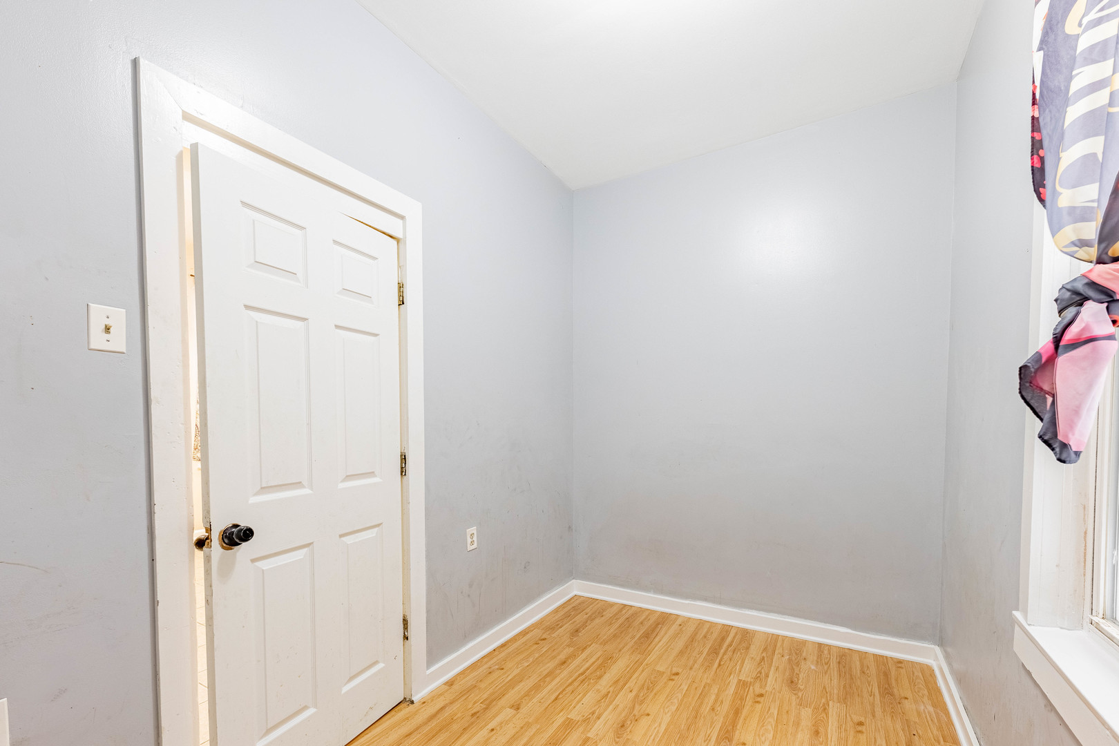 3022 South Homan Avenue Chicago, IL 60623 - Photo 22 of 29 a view of a small space with wooden floor and a window