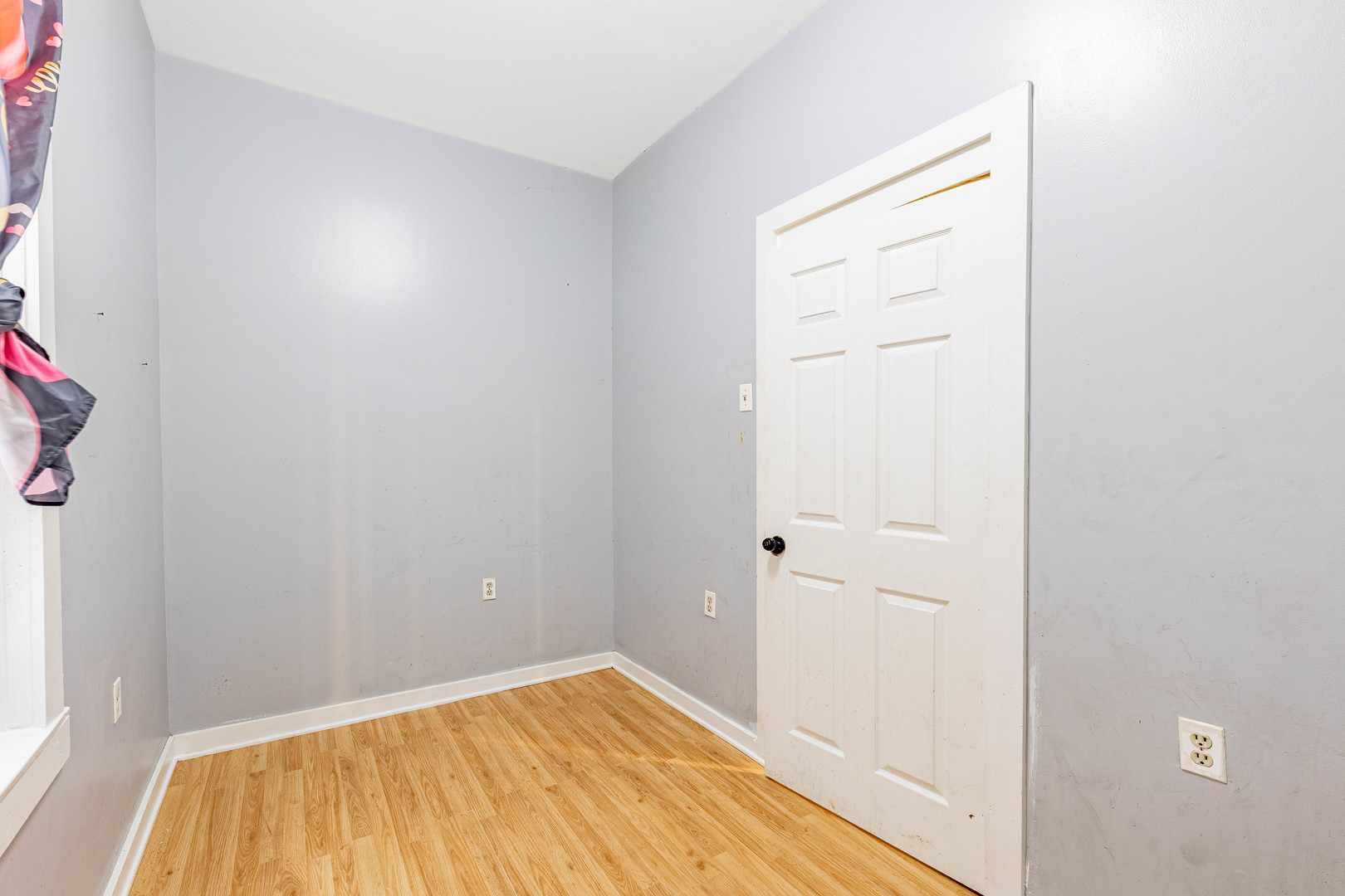 3022 South Homan Avenue Chicago, IL 60623 - Photo 23 of 29 a view of a room with wooden floor and a bathroom