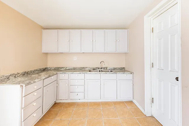 a bathroom with a shower and a sink