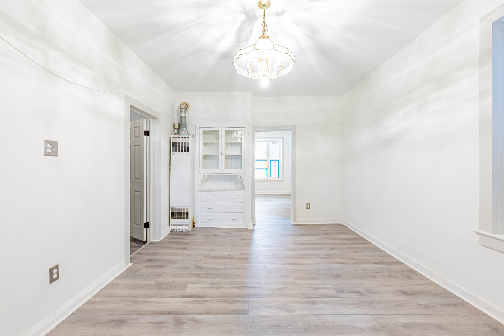3022 South Homan Avenue Chicago, IL 60623 - Photo 4 of 29 a view of a room with wooden floor and window