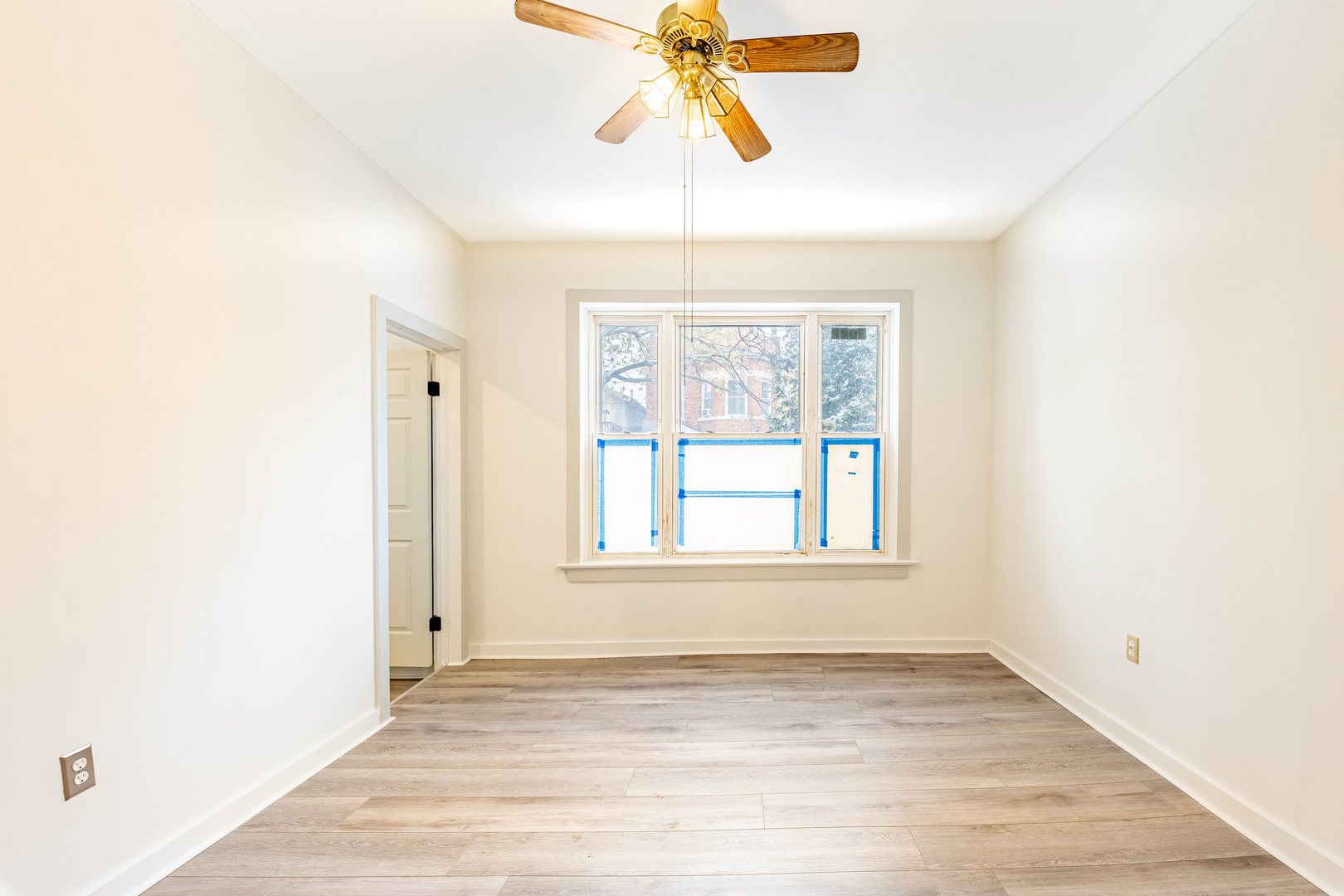 3022 South Homan Avenue Chicago, IL 60623 - Photo 6 of 29 an empty room with fan and windows