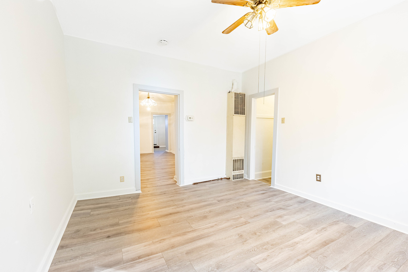 3022 South Homan Avenue Chicago, IL 60623 - Photo 8 of 29 a view of a room with wooden floor