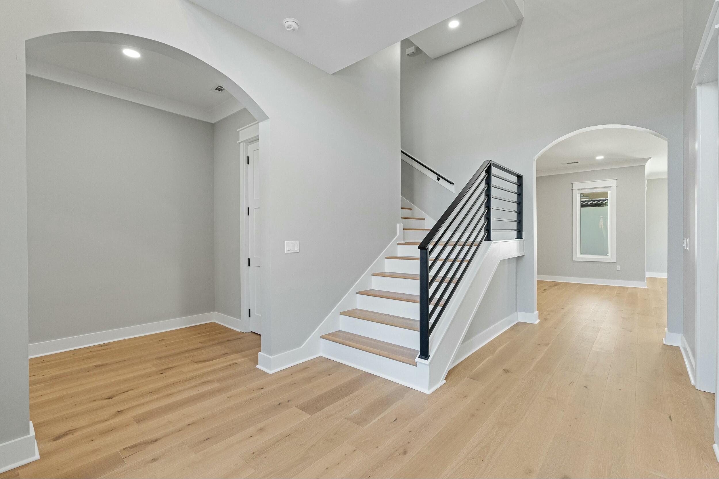 198 Emerald Ridge Santa Rosa Beach, FL 32459 - Photo 13 of 66 a view of a hallway with staircase and white walls