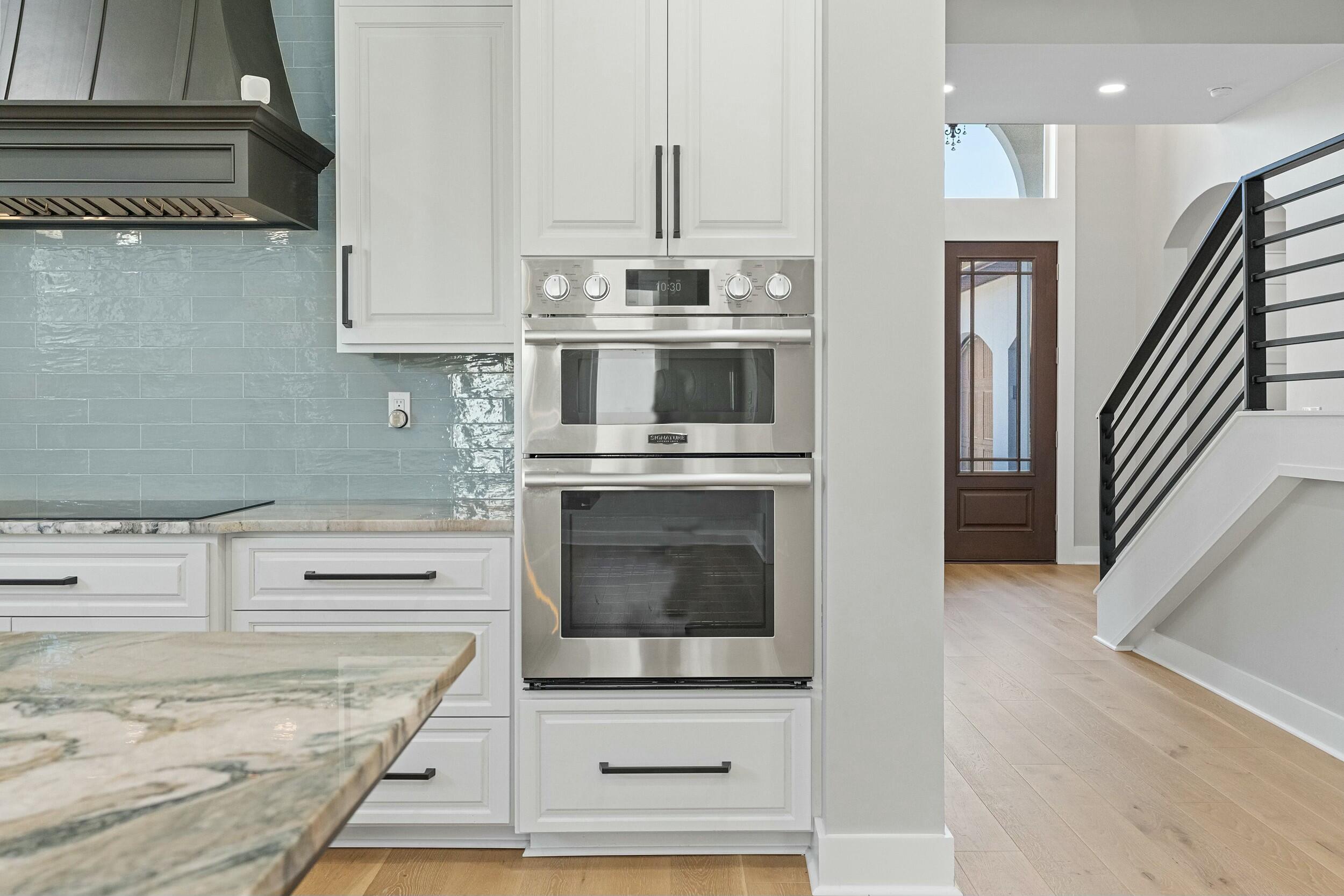 198 Emerald Ridge Santa Rosa Beach, FL 32459 - Photo 19 of 66 a kitchen with granite countertop a stove and a sink