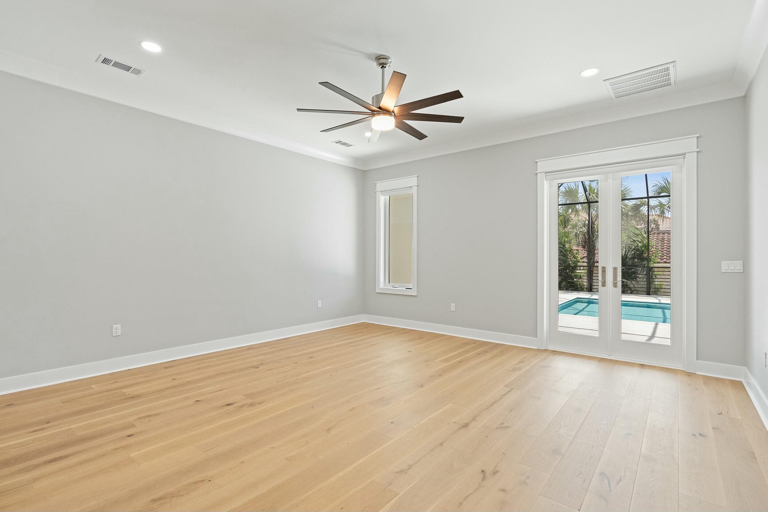 198 Emerald Ridge Santa Rosa Beach, FL 32459 - Photo 29 of 66 wooden floor in an empty room with a window