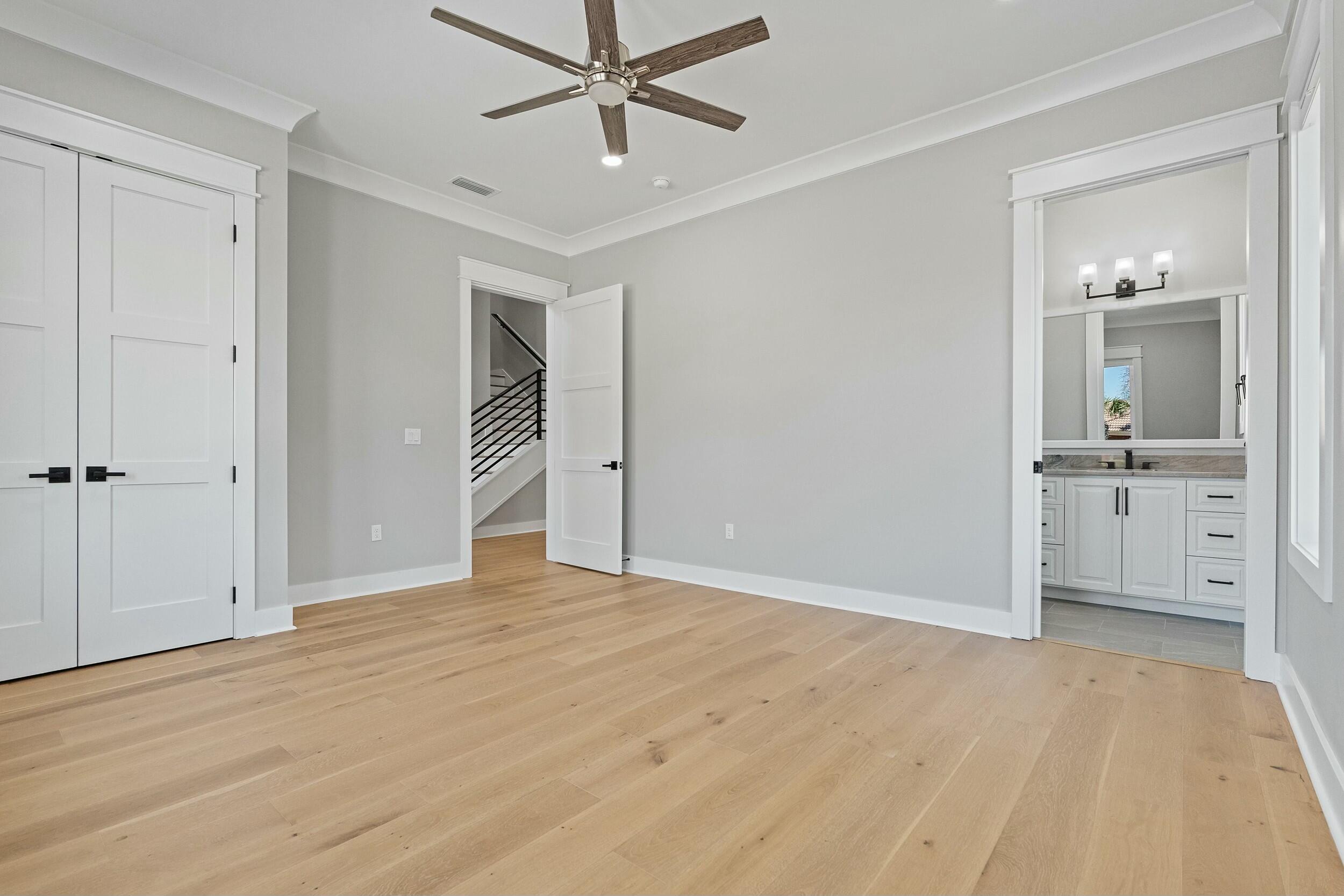198 Emerald Ridge Santa Rosa Beach, FL 32459 - Photo 37 of 66 a view of empty room with wooden floor and cabinet