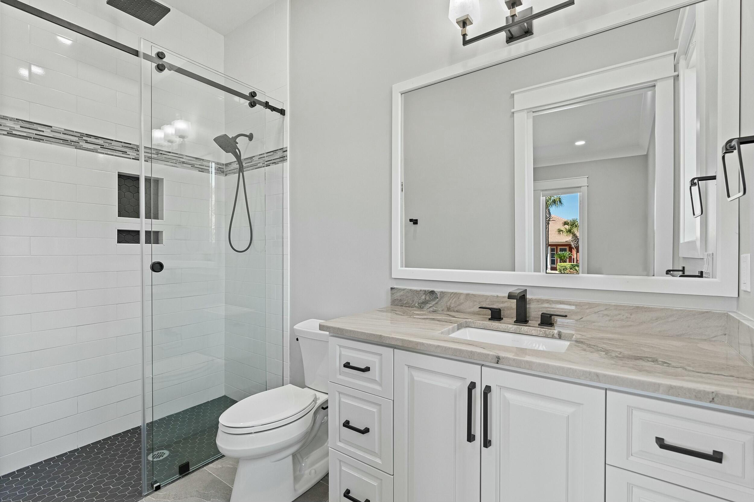 198 Emerald Ridge Santa Rosa Beach, FL 32459 - Photo 38 of 66 a bathroom with a sink toilet and shower