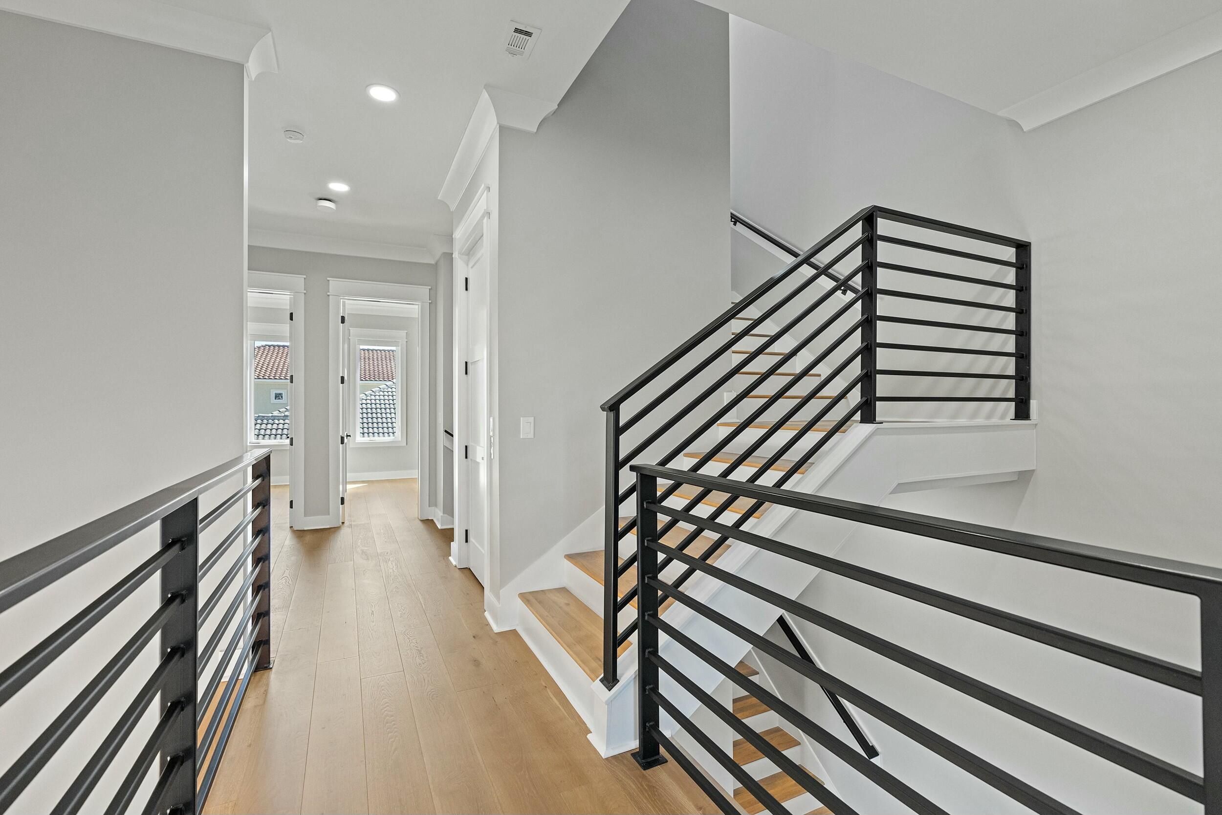 198 Emerald Ridge Santa Rosa Beach, FL 32459 - Photo 40 of 66 a view of a hallway with wooden floor and stairs