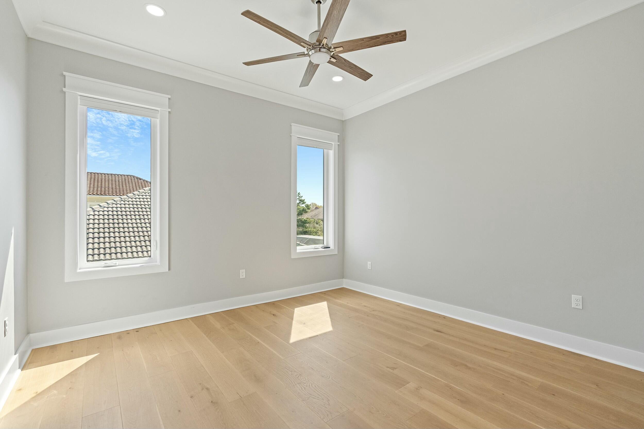 198 Emerald Ridge Santa Rosa Beach, FL 32459 - Photo 41 of 66 wooden floor in an empty room with a window