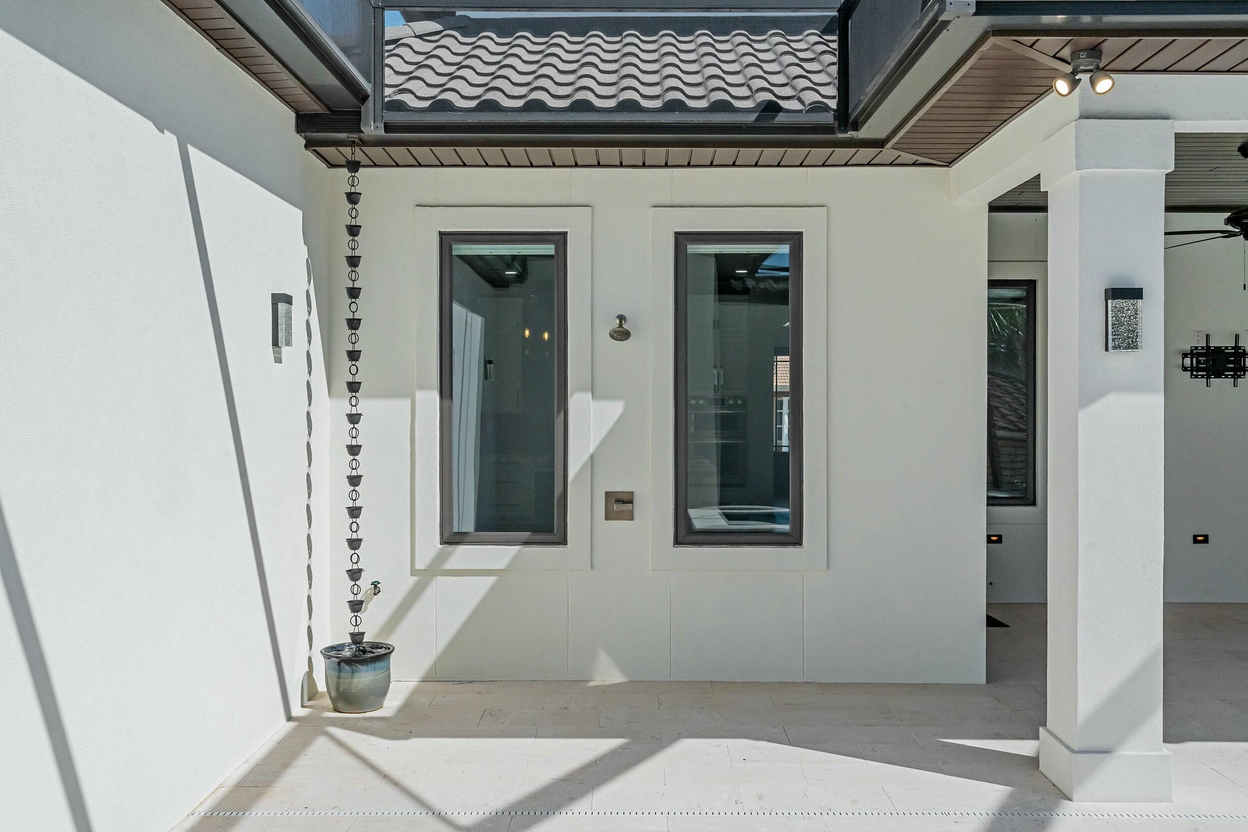 198 Emerald Ridge Santa Rosa Beach, FL 32459 - Photo 56 of 66 a front view of a house with large windows