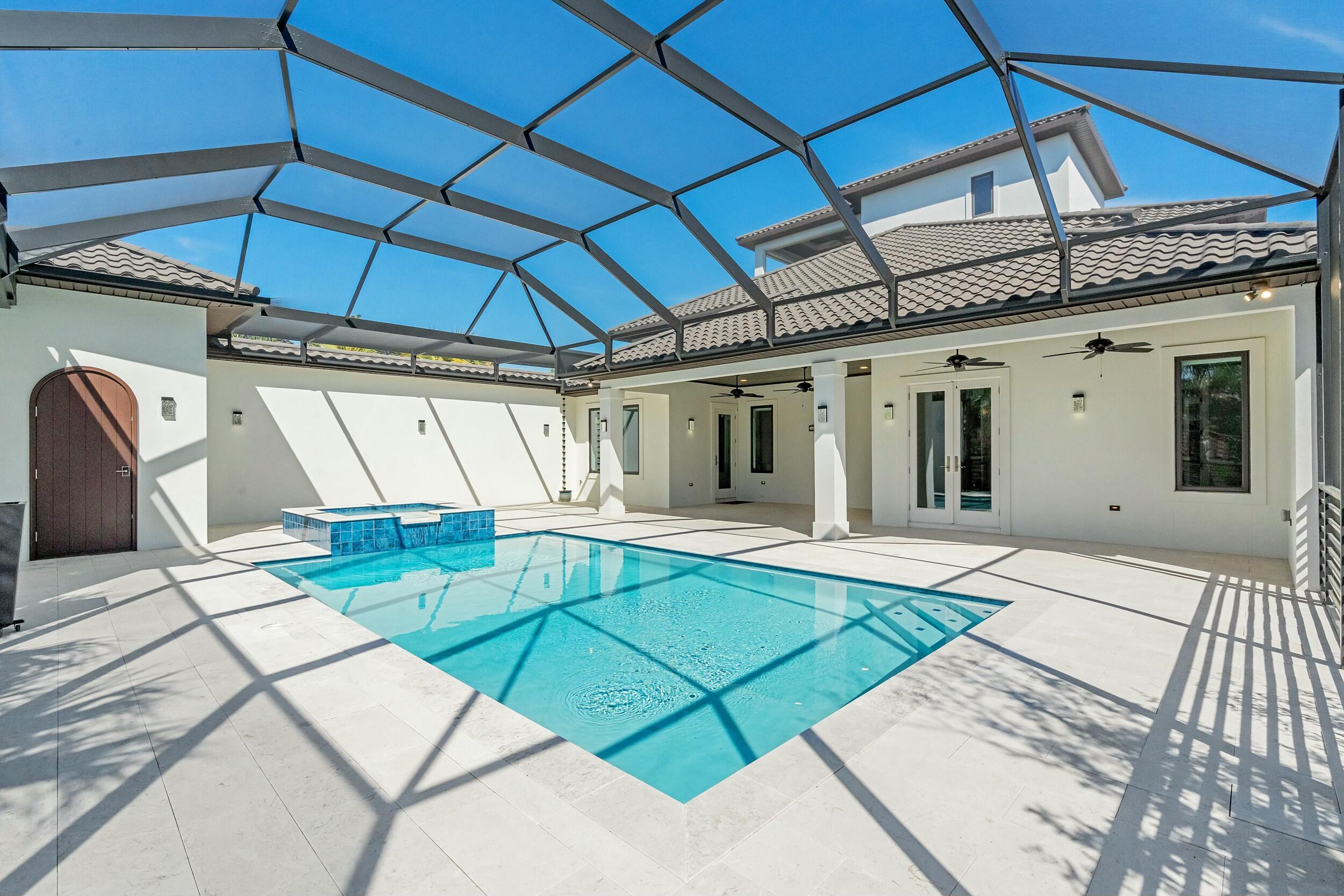 198 Emerald Ridge Santa Rosa Beach, FL 32459 - Photo 60 of 66 a view of a backyard with table and chairs under an umbrella
