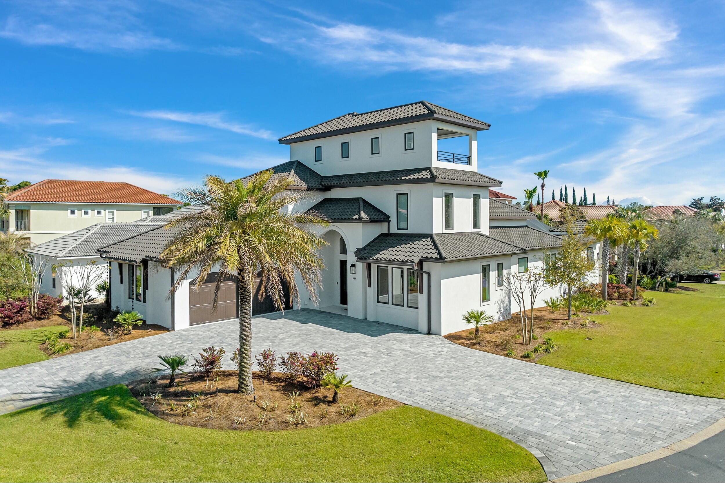 198 Emerald Ridge Santa Rosa Beach, FL 32459 - Photo 6 of 66 a front view of a house with a yard