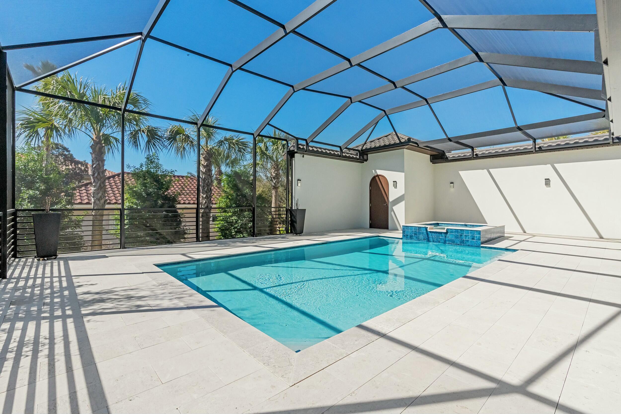 198 Emerald Ridge Santa Rosa Beach, FL 32459 - Photo 63 of 66 a view of a backyard with a small deck and a chair