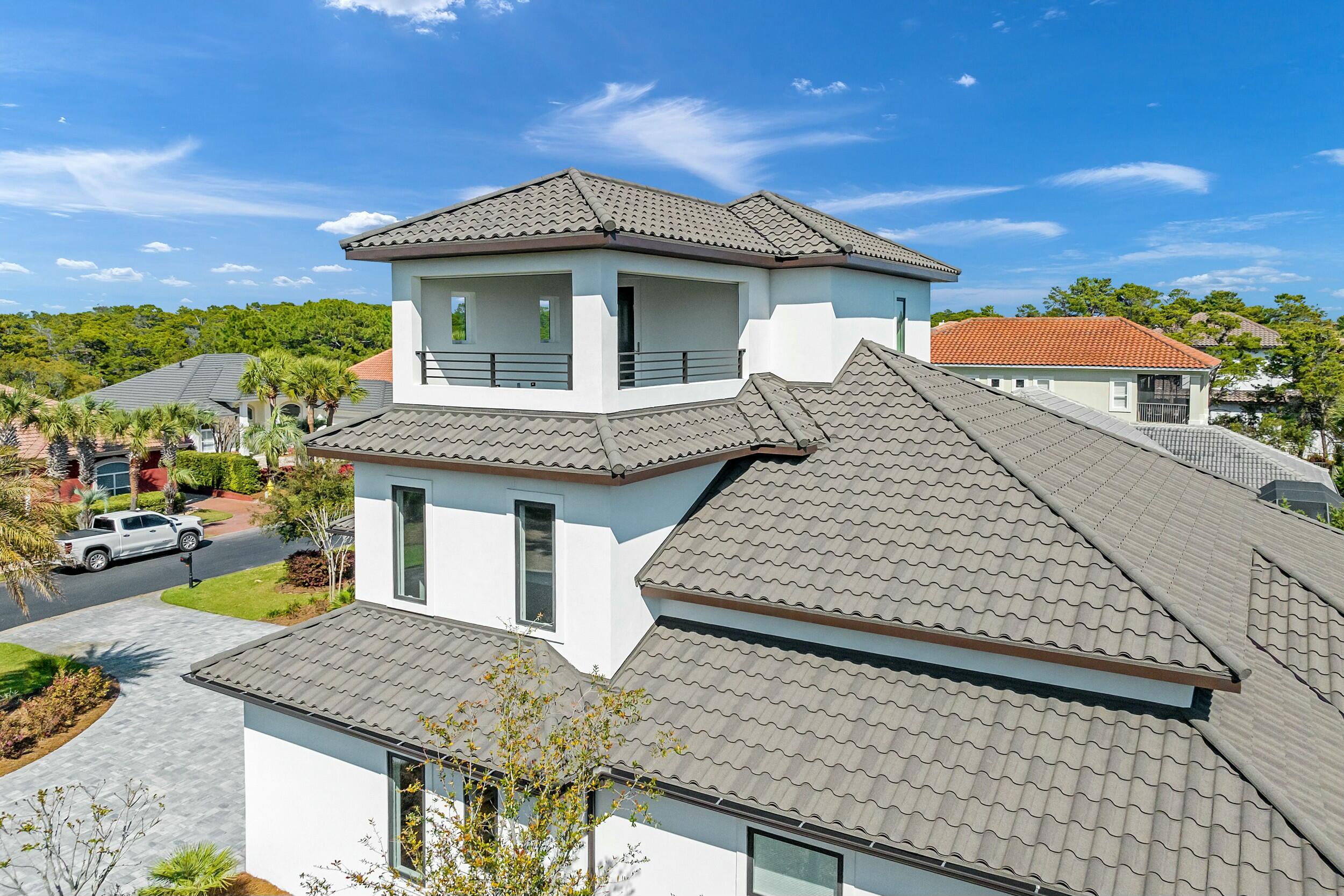 198 Emerald Ridge Santa Rosa Beach, FL 32459 - Photo 9 of 66 a front view of a house with a garden
