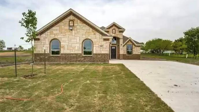 8008 County Road 1058 Rice, TX 75155 - Photo 1 of 25 Stone and brick exterior with arched windows, prominent front entry, and a multi-gabled roofline