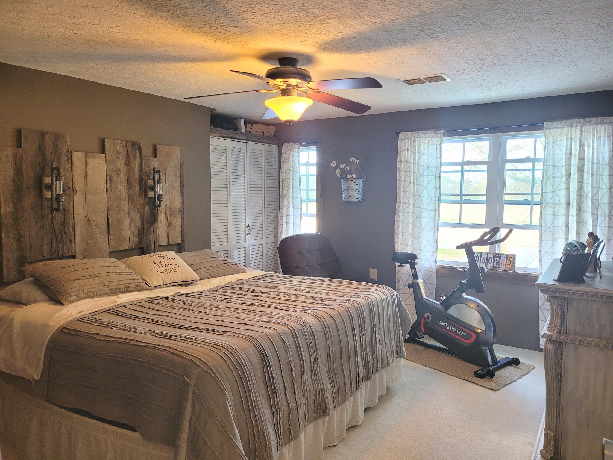 196 Nate Floyd Road Manchester, TN 37355 - Photo 14 of 36 a bedroom with a bed and a chandelier