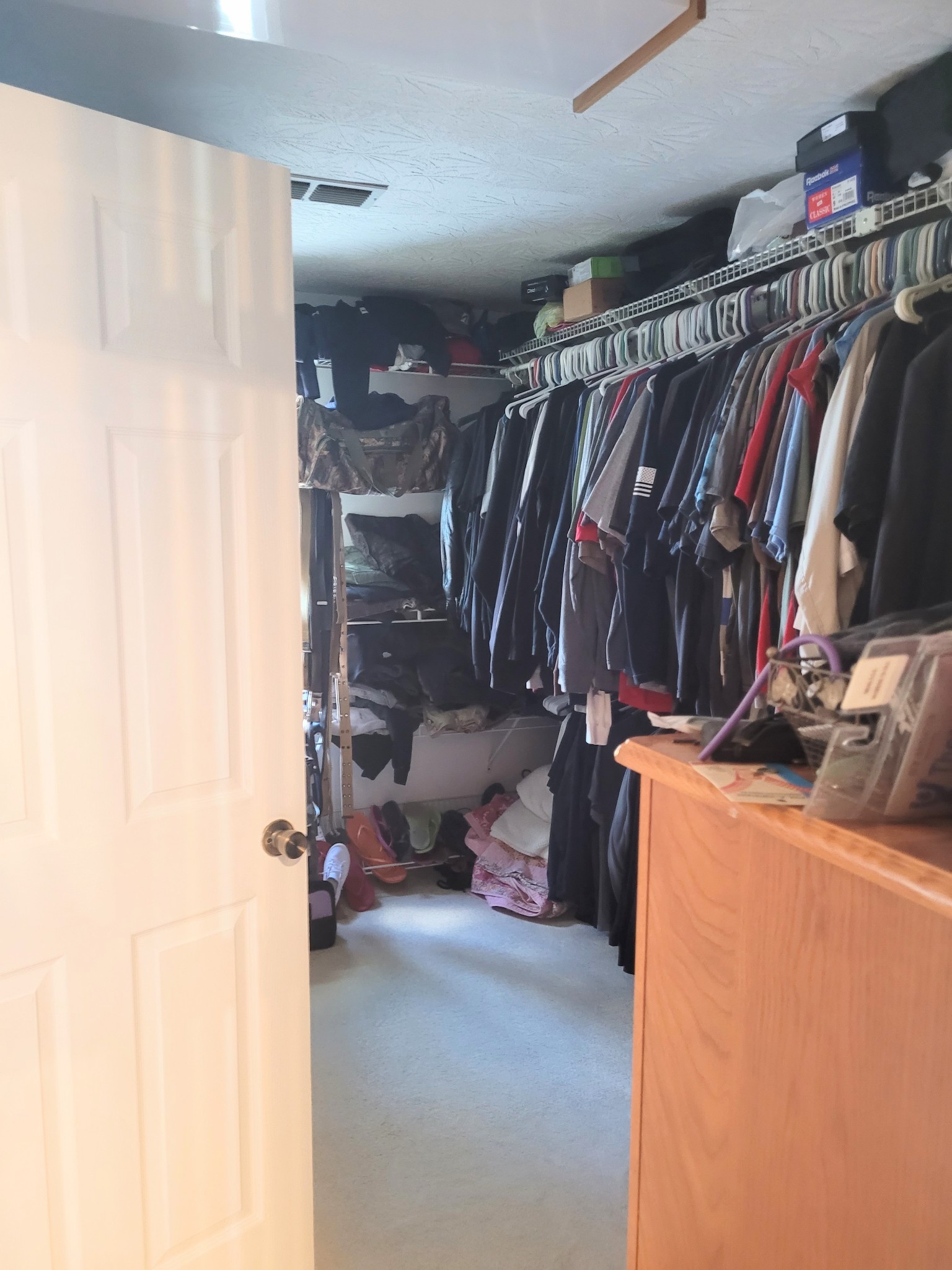 196 Nate Floyd Road Manchester, TN 37355 - Photo 18 of 36 a view of walk in closet with clothes and shoes